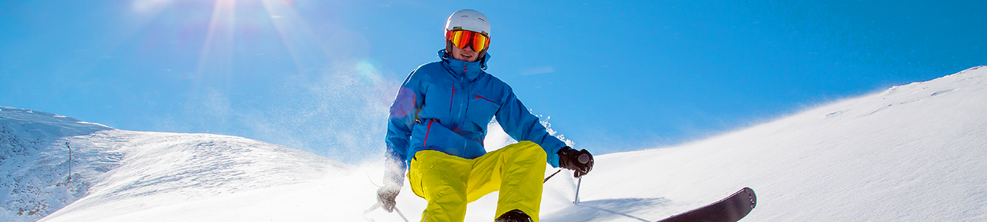 A man skiing down a mountain side