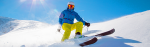 A man skiing down a mountain side