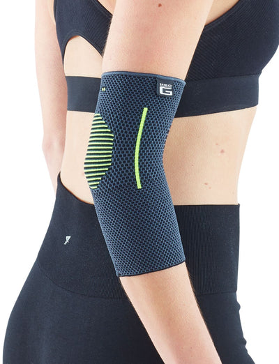 Woman wearing Neo G Active Elbow Support facing  side