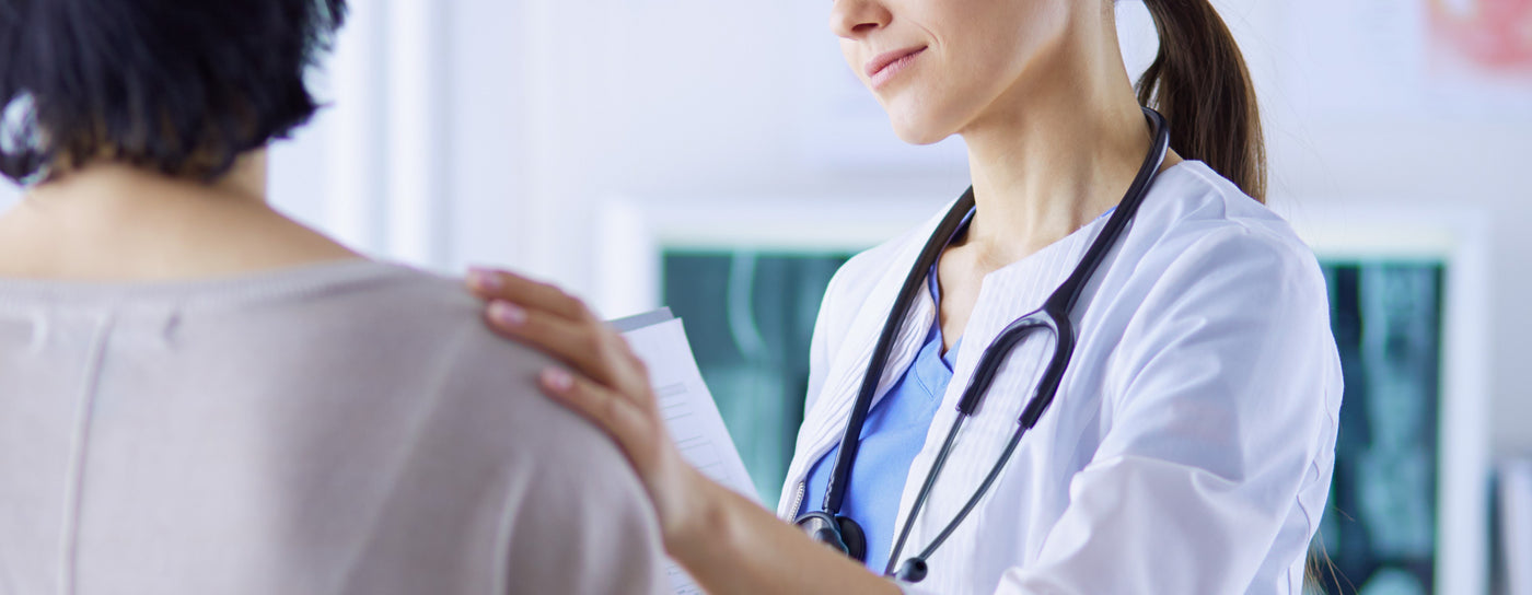 A doctor comforting a patient